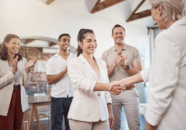 istock Handshake, success deal and teamwork training for office collaboration support, partnership trust or b2b crm. Diversity, smile or happy business people clapping for goal, target or success in meeting 1449053579