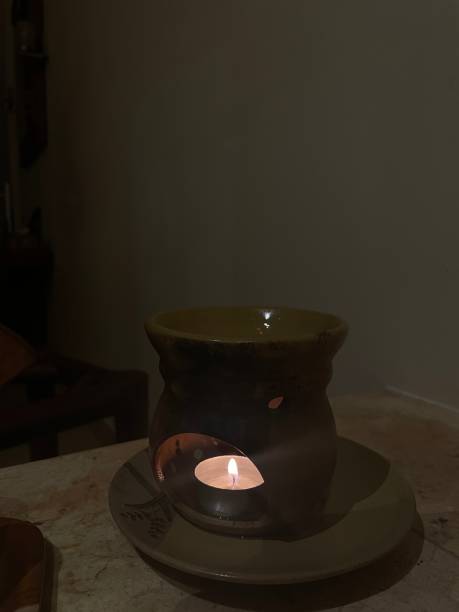 istock Candle burn on the clay pot 1449054359