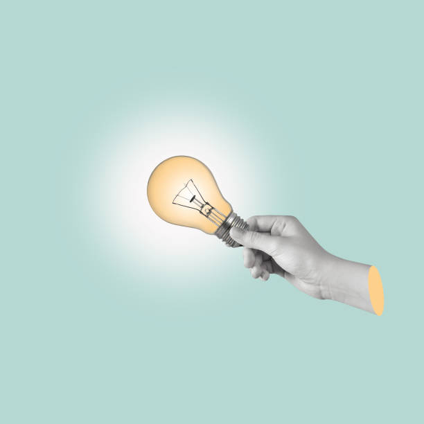 istock Modern art collage of a hand holding a light bulb. 1449055601