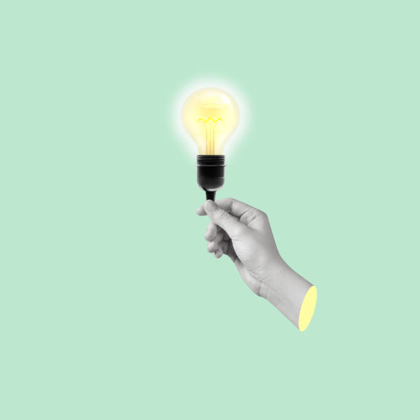 istock Modern art collage of a hand holding a light bulb. 1449055605