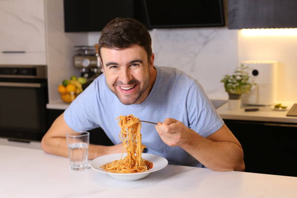 istock Man enjoying a plate of spaghetti 1449061803