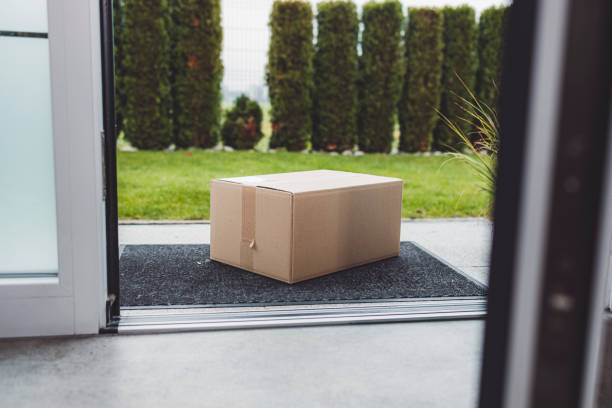 istock View from inside out, package sitting at the front door waiting to be picked up 1449062717
