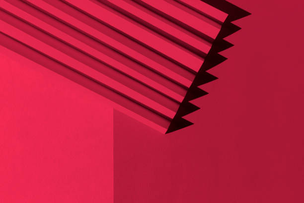 viva magenta color of the year 2023. abstract crimson red color  paper texture. folded paper with harsh sun shadows, geometric shapes and lines. - viva magenta stok fotoğraflar ve resimler