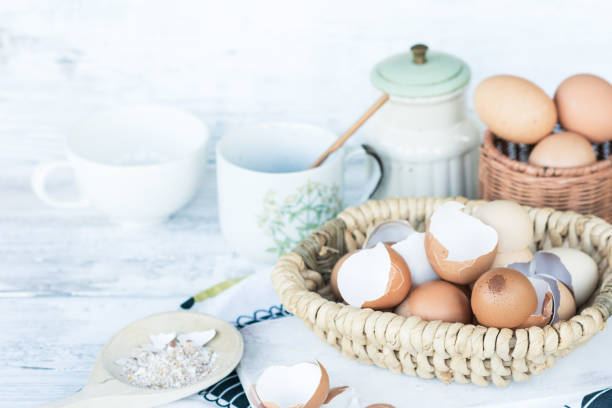istock Brown and white eggshells placed in basket in home kitchen on table, eggshells stored for making natural fertilizers for growing vegetables 1449067820