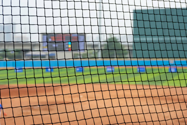 istock baseball field behind the netting 1449070272