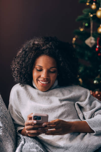 istock A Happy Beautiful Businesswoman Using Her Mobile Phone While Relaxing At Home 1449072003
