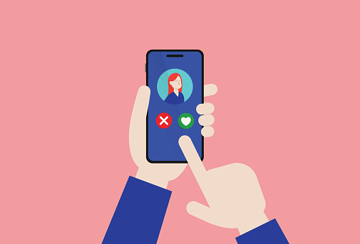 Hand holds a mobile phone for use in a dating app