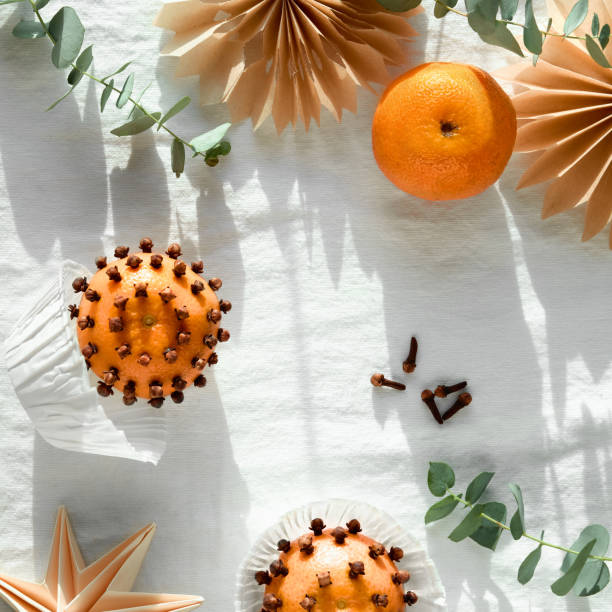 Orange studded cloves isolated on the white background