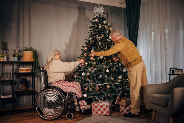 istock Senior couple decorating Christmas tree at home 1449079761