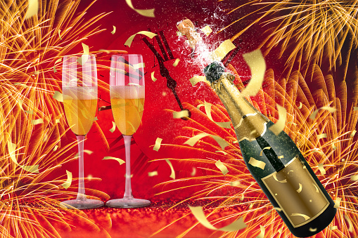 Happy New Year, celebration background with two glasses and uncorked champagne bottle splashing.