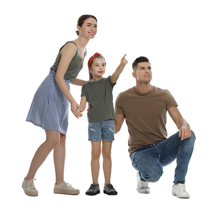 Little girl with her parents on white background