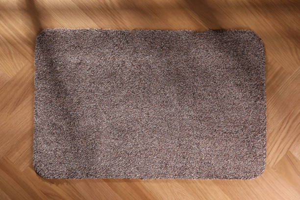 istock Stylish door mat on floor, top view 1449082108