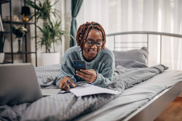 istock Woman working in bed 1449082671
