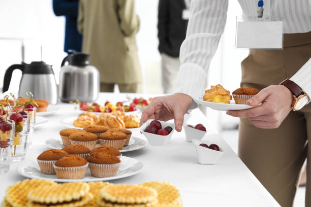 woman taking snack during coffee break, closeup - waffle breakfast food sweet food imagens e fotografias de stock