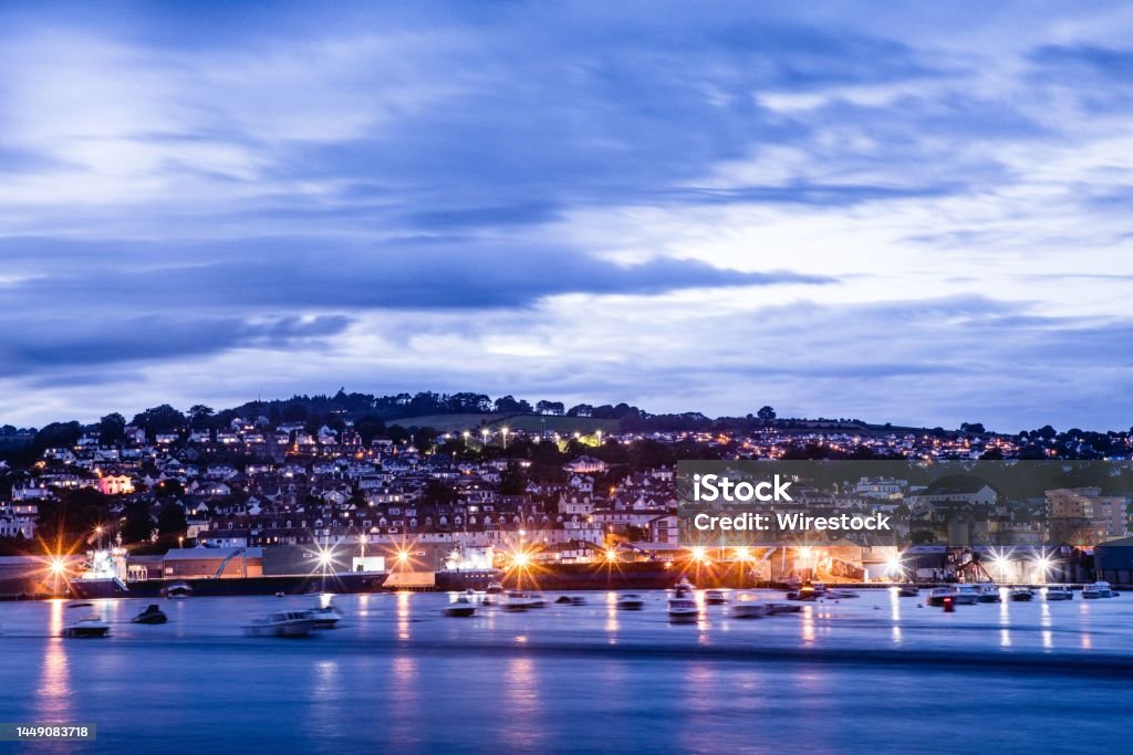 Long exposure shot of Teignmouth at dusk from Shaldon beach in Devon A long exposure shot of Teignmouth at dusk from Shaldon beach in Devon Architecture Stock Photo