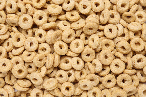 istock Sweet tasty corn rings as background, top view 1449084439