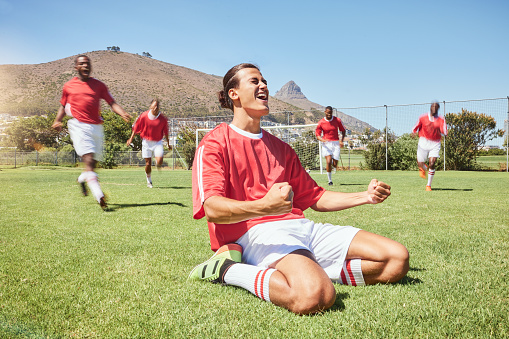 Soccer, soccer team and celebration on soccer field for winning, goal or score in match. Victory, winner and success in sports game or competition with soccer players training, workout or exercise.