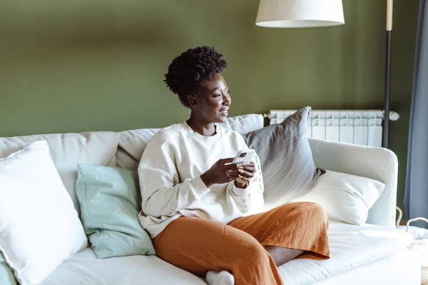 istock Young woman relaxing at home an looking away 1449086033