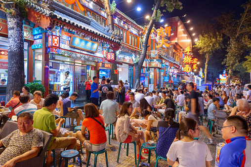 Beijing, China - June 28, 2014: Crowds gather Guijie Street. The street is a popular nightlife destination.