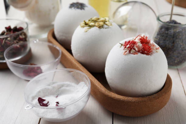 istock Different bath bombs and ingredients on white wooden table, closeup 1449087412