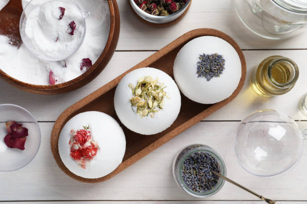 istock Flat lay composition with bath bombs and ingredients on white wooden table 1449088165