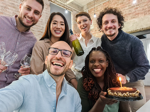 istock Colleagues Taking A Selfie At The Office Birthday Party 1449089020