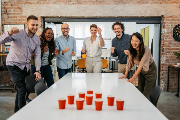 istock Colleagues Playing Beer Pong At The Office 1449089115
