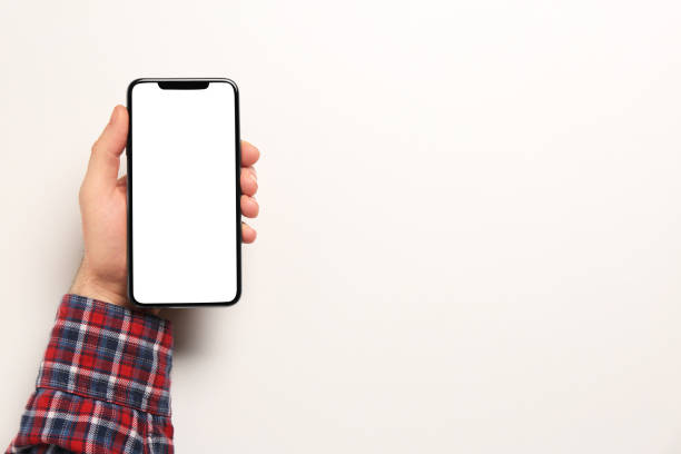 istock Man with smartphone on white background, top view. Space for text 1449089140