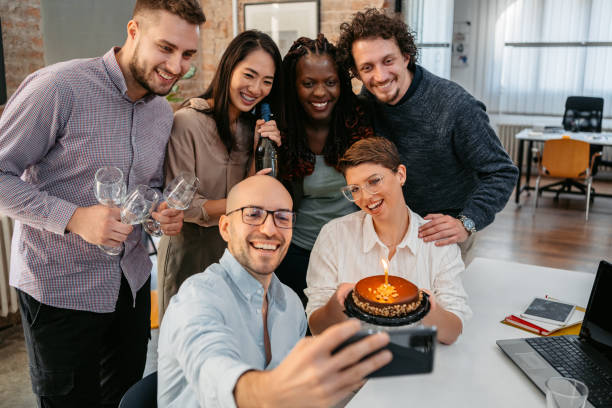 istock Colleagues Taking A Selfie At The Office Birthday Party 1449089225