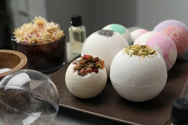 istock Plate with different bath bombs on wooden table, closeup 1449090770