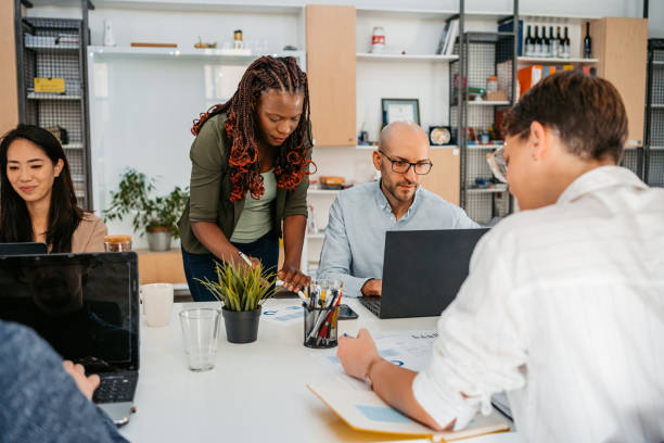 istock Colleagues Working Together In The Office 1449091103