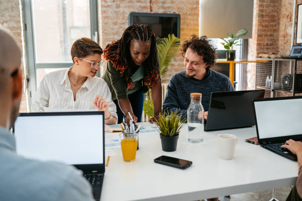 istock Colleagues Consulting With Each Other While Working Together In The Office 1449091268
