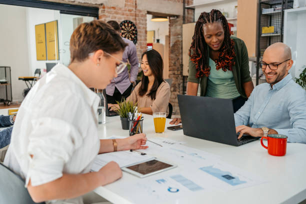 istock Colleagues Working Together In The Office 1449091523