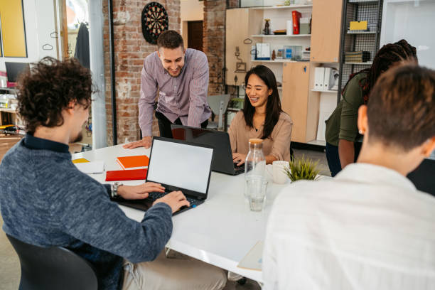 istock Colleagues Working Together In The Office 1449091582