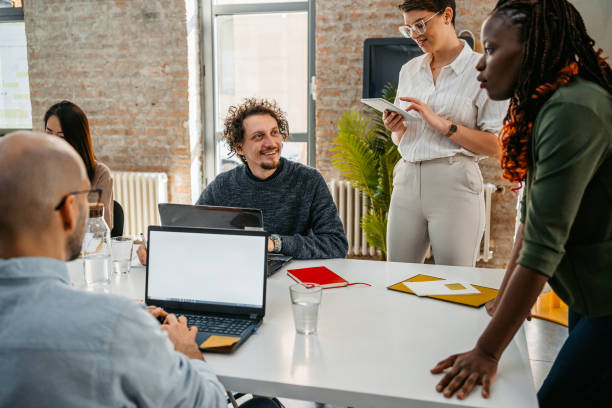 istock Colleagues Working Together In The Office 1449091624