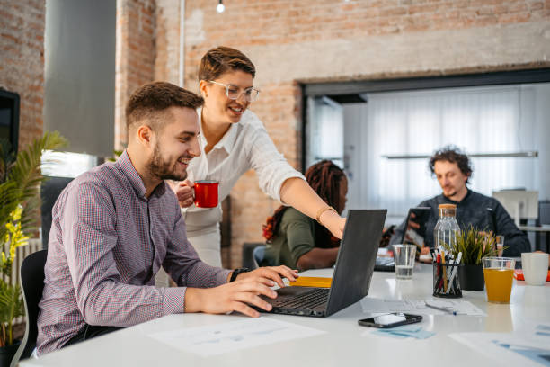 istock Colleagues Consulting With Each Other While Working Together In The Office 1449092881