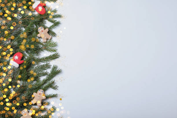 istock Christmas greeting card with space for text. Flat lay composition of fir tree branches and festive decor on white background 1449092898
