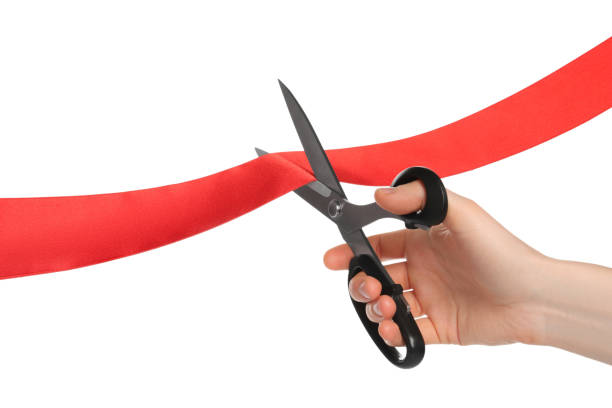 istock Man cutting red ribbon on white background, closeup 1449092953