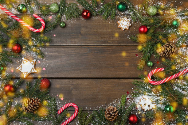 istock Christmas greeting card with space for text. Flat lay composition of fir tree branches and festive decor on wooden background 1449093493