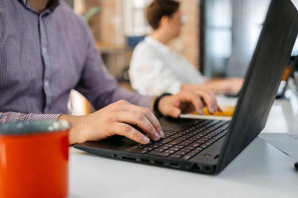 istock Male Office Worker Working On Laptop At The Office 1449096423
