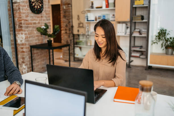 istock Female Office Worker Working On The Laptop At The Office 1449096488