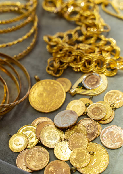 Close-up of gold jewelry and gold coins stock photo