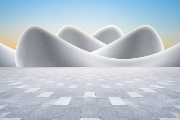 Modern art curved building with empty brick square against clear sky background