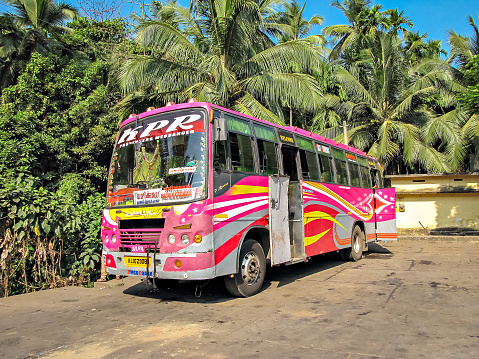 Vazhikkadavu, Malayapuram, Kerala, India-January 31st, 2014: Colorful passenger bus plying between Kozhikode and Vazhikkadavu. Translation of text in local language is Kozhikode to Vazhikkadavu .