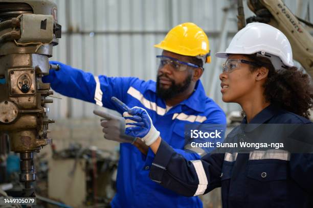 Both Of Engineers Are Consulting And Exchanging Repair Experience With Each Other Stock Photo - Download Image Now
