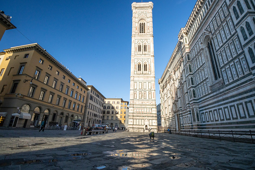 View of the Leaning Tower of Pisa on a sunny day in the city of Pisa, Italy.