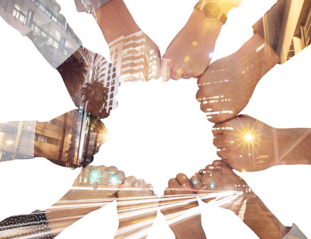 istock Fist bump, double exposure and corporate people for teamwork, city development and night innovation collaboration. Overlay of urban street lights with partnership, goal or support business hands sign 1449109214