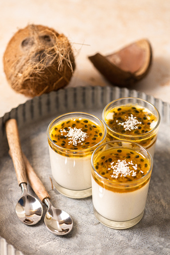 vegan Coconut Panna Cotta with Passion Fruit topping and ground coconut for Veganuary recipes
