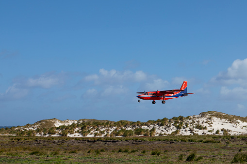 Islander prop lane operated by FIGAS coming in to land on Sea Lion Island, Falkland Islands.