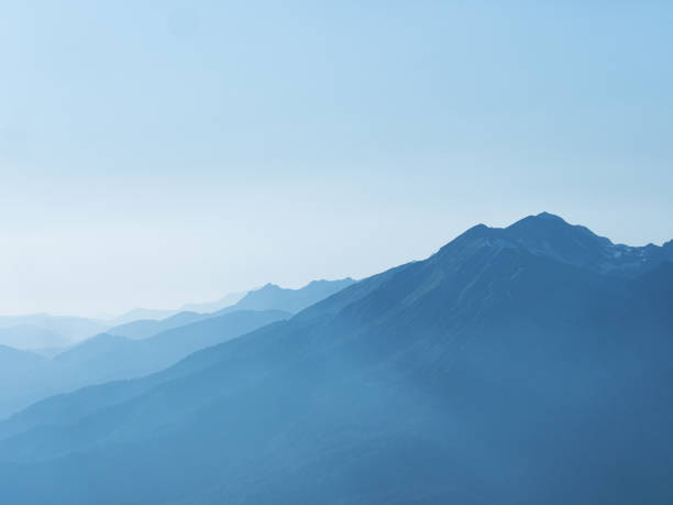 istock Light blue mountains in the distance, aerial perspective, mountain atmosphere. 1449113668